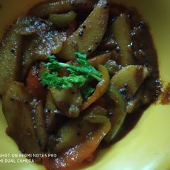 A picture of Capsicum and potato ki sabzi.