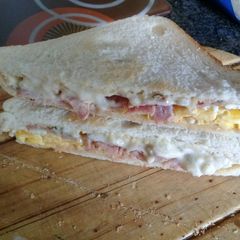 A picture of Bacon and egg deluxe sandwich.