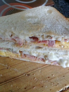 A picture of Bacon and egg deluxe sandwich.