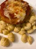 Parmesan chicken over macaroni and cheese