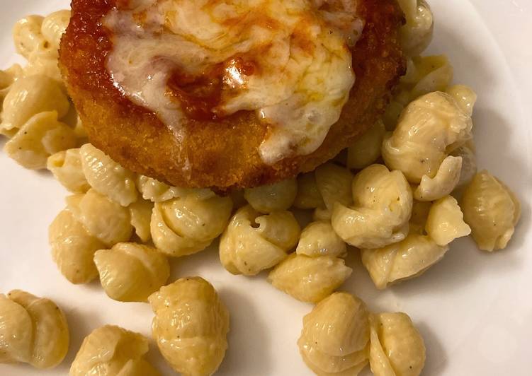 Parmesan chicken over macaroni and cheese