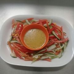 A picture of Fresh garden salad in vinegrate dressing/sauce.