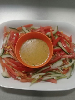 A picture of Fresh garden salad in vinegrate dressing/sauce.