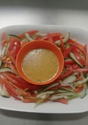 A picture of Fresh garden salad in vinegrate dressing/sauce.