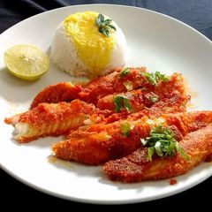 A picture of Fish fillet with rice.