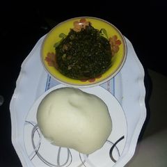 A picture of Vegetable soup and fufu.