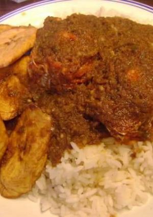 A picture of Peppered Stew with White Rice & Fried Plantain.