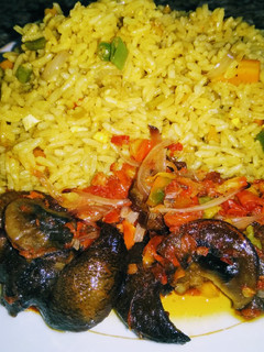 A picture of Fried rice n Peppered snail.