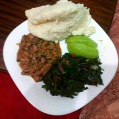 Ugali, spinach, avocado with wet fried beef A picture of Ugali, spinach, avocado with wet fried beef.