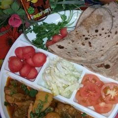 Chicken Alu with roti A picture of Chicken Alu with roti.