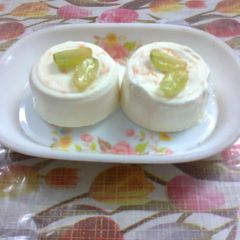 A picture of Panna cotta with orrange rind.