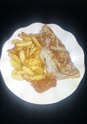 A picture of Chips with fried egg.