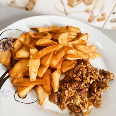 A picture of Fried sweet potatoes with Egg and Sausage sauce.