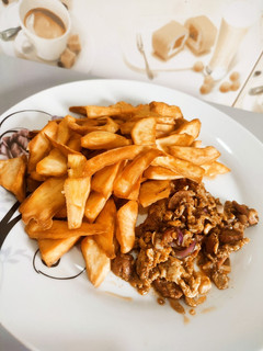A picture of Fried sweet potatoes with Egg and Sausage sauce.