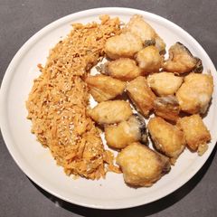 A picture of Crispy Fried Salmon with Sautéed Carrot.