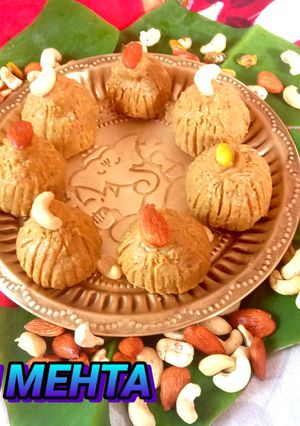बेसन और मिल्क पाउडर का मोदक रेसिपी मुख्य फोटो