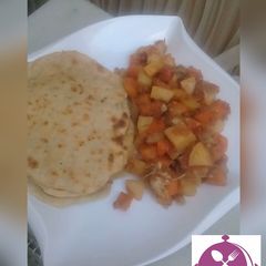 A picture of Chapatti with potato soup.