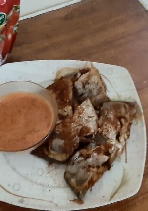 A picture of Fish with sauce.