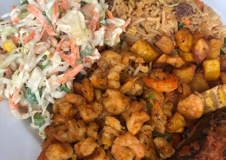 Rice excurted by shrimps, plantain and salad and mackerel