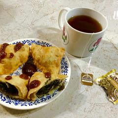 A picture of FRYday Samosa stuffed with Mushrooms and Kale.