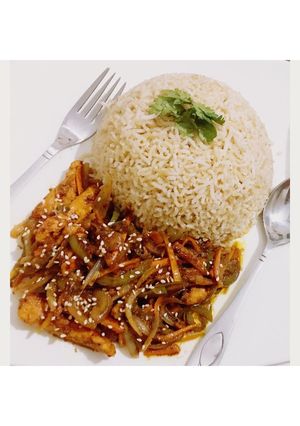 A picture of Chinese style chicken and veggies with brown rice.