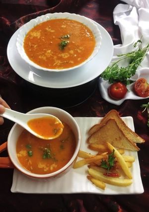 A picture of Cheesy grilled tomato soup.