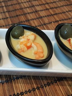 Una foto de Tapa de gambón leche de coco y curry