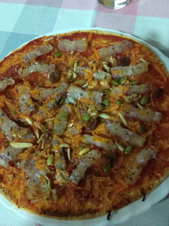 Una foto de Pizza de bacon con frutos secos