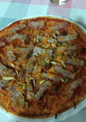 Una foto de Pizza de bacon con frutos secos