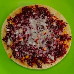 A picture of Beetroot corn cheese pizza.