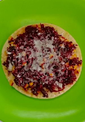 A picture of Beetroot corn cheese pizza.
