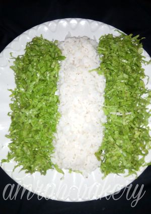 A picture of Nigerian rice with salad.