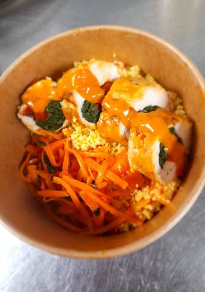 A picture of Stuffed Chicken and cous cous salad.