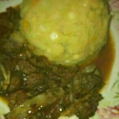 Mukimo served with beef stew A picture of Mukimo served with beef stew.