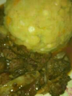A picture of Mukimo served with beef stew.