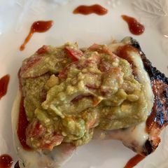 A picture of Barbecue Boneless Thighs with Pepper Jack Cheese and Guacamole.
