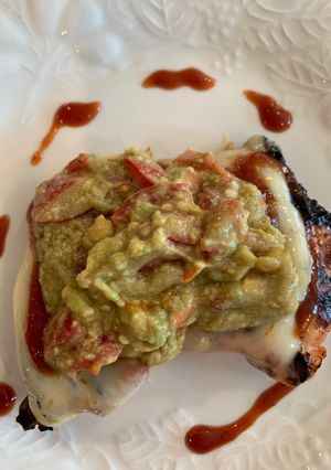 A picture of Barbecue Boneless Thighs with Pepper Jack Cheese and Guacamole.