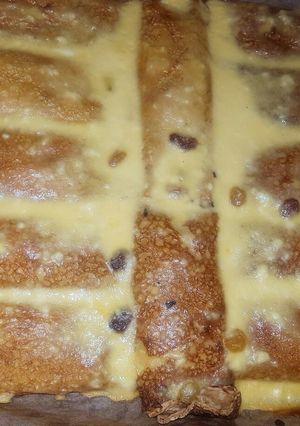O poză a rețetei Clătite cu brânzică dulce și stafide la cuptor.