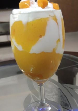 A picture of Mango smoothie with cream.