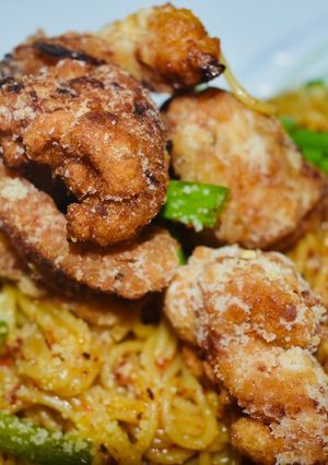 A picture of Asian Fusion Pasta with Chicken Popcorn.
