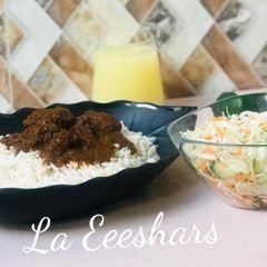 A picture of White rice,stew and simple salad.