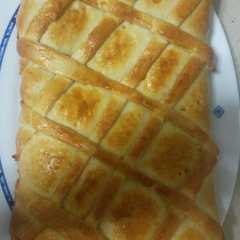 Una foto de Empanada de pollo asado
