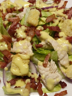 A picture of Lemon chicken salad, crispy pancetta & my zingy salad dressing.