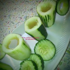 Cucumber cup with amazing drink A picture of Cucumber cup with amazing drink.