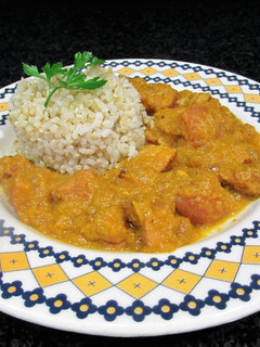 Una foto de Panceta en salsa de calabaza al brandy con guarnición de arroz integral