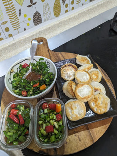 A picture of Pan-Fried Dumplings with Chive Dipping Sauce.