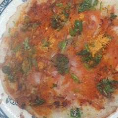 A picture of Tomato, onion uttapa.