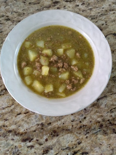 A picture of Potatoes with Ground Pork in Green Sauce.