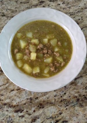 Una foto de Papas con carne molida en salsa verde