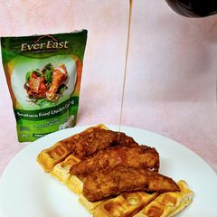 A picture of Southern Fried Chicken & Waffles 🍗🧇 Drizzled with Maple Syrup.
